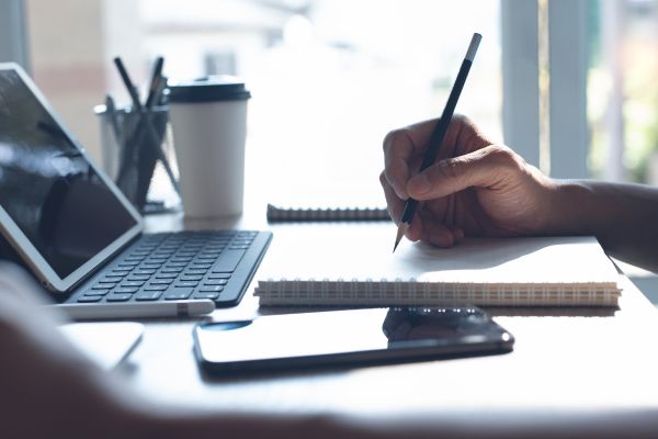 Happy professional using microlearning on a mobile device for workplace skills in 2025